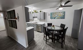 Mesa apartment for rent - an open kitchen and dining area with a table and chairs