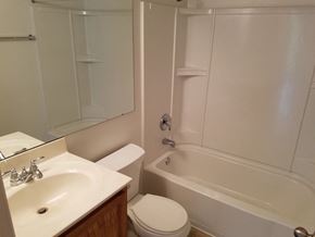 Saint Charles apartment for rent - A white bathroom with a sink, toilet and bathtub.