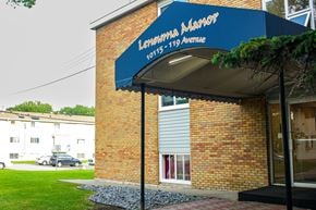 Edmonton apartment for rent - a blue awning on the side of a brick building