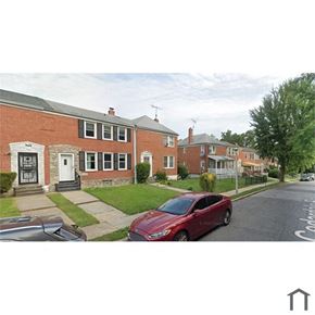 Baltimore apartment for rent - a red car parked on the side of a street
