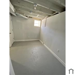 Baltimore house for rent - A room with a window and a door.