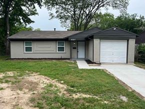 Mesquite house for rent - A house with a grey roof and a white garage door.