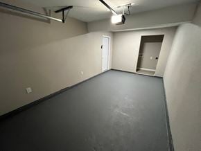 Mesquite house for rent - A spacious room with a door and a window.