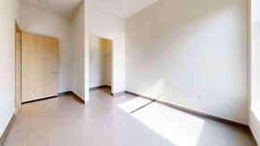 Minneapolis apartment for rent - an empty living room with a door to a closet