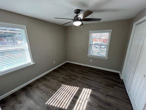 Dallas house for rent - A room with a ceiling fan and a window letting in sunlight.