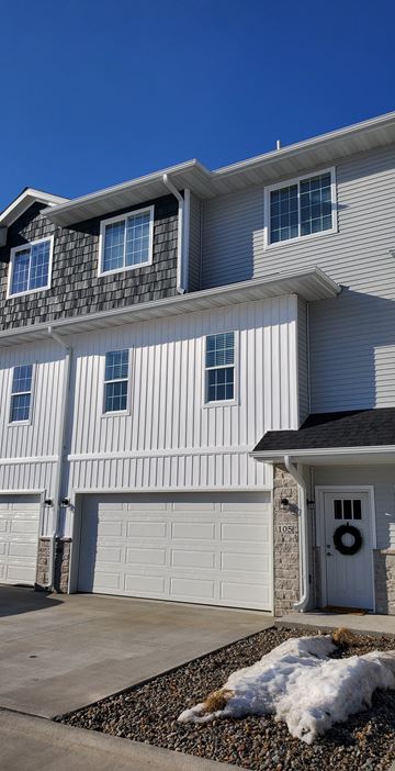 Van Meter apartment for rent - a white house with a garage door in front of it
