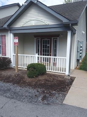 Lewisburg apartment for rent - a house with a porch and a sign on the side of it