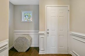 Fayetteville house for rent - a room with white walls and a white door and a window