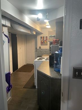 Washington apartment for rent - A kitchen area with a fridge, a microwave, and a dishwasher.
