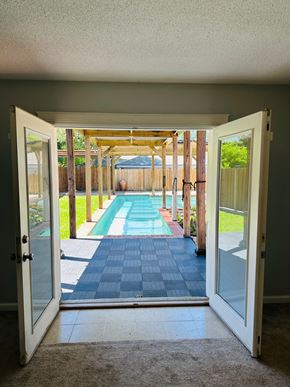 Lafayette house for rent - a view of a pool from a room with open doors