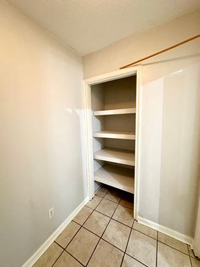 Lafayette house for rent - an empty closet in an empty room with a tiled floor