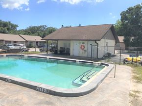 Bradenton house for rent - a swimming pool in front of a house