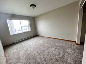 Grand Forks apartment for rent - an empty room with carpet and a window
