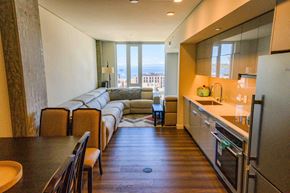 Seattle apartment for rent - A kitchen with a refrigerator, oven, and sink.
