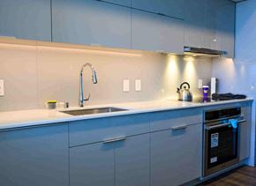 Seattle apartment for rent - A modern kitchen with a sink and a stove.