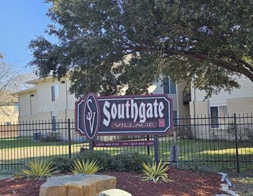 College Station apartment for rent - A sign for Southgate Village with a phone number on it.