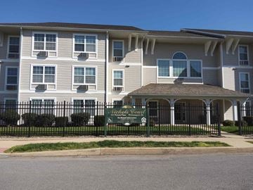 Williamsport apartment for rent - a large white building with a sign in front of it