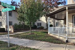 Berwick apartment for rent - a sidewalk in front of a house with a street sign