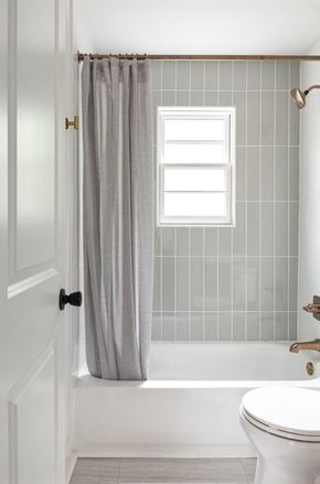 Atlanta apartment for rent - a bathroom with a toilet and a bath tub and a shower curtain