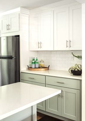 Atlanta apartment for rent - a white kitchen with gray cabinets and a stainless steel refrigerator