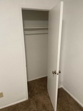 Arlington apartment for rent - a room with a closet and an open door