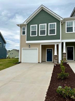 Moore house for rent - a large house with a driveway and a garage door