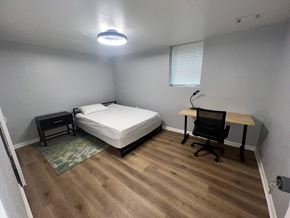 Atlanta apartment for rent - A bedroom with a bed, desk, and chair.