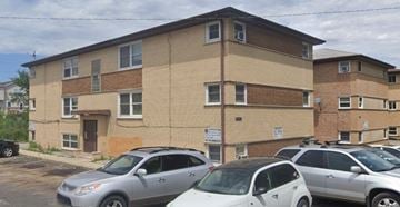 Blue Island apartment for rent - an apartment building with cars parked in front of it