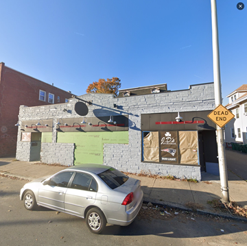 Lynn apartment for rent - a car parked in front of a building with graffiti on it