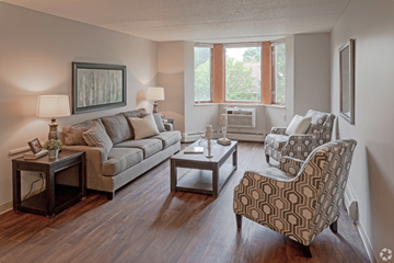 Saint Paul apartment for rent - a living room with couches and chairs and a window