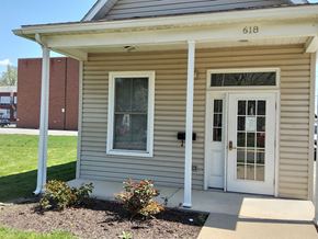 Williamsport apartment for rent - the front of a tan house with a white door