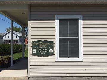 Williamsport apartment for rent - a sign on the side of a white house with a window