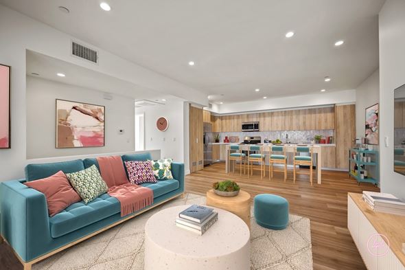 Los Angeles apartment for rent - A living room with a blue couch and a white coffee table.