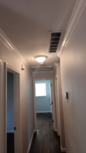 Atlanta house for rent - A long hallway with a light on the ceiling and a door at the end.