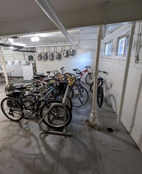 Chicago apartment for rent - A bike rack full of bicycles in a garage.