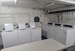 Chicago apartment for rent - A row of washing machines in a laundromat.