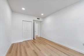 Mountain View house for rent - a living room with white walls and wood floors