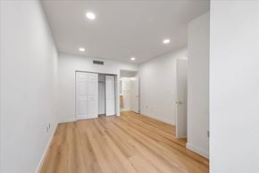 Mountain View house for rent - a living room with white walls and wood floors