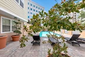 Mountain View house for rent - a backyard with a pool and a patio with chairs and a table