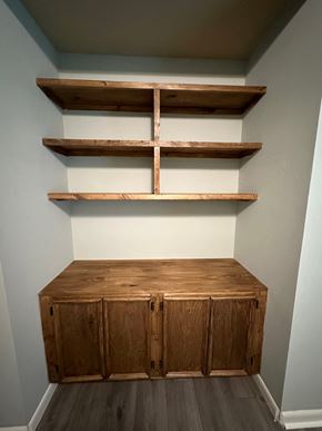 Lafayette house for rent - a dresser with shelving and two shelves on the wall
