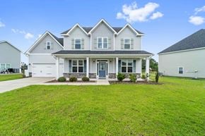 Maple Hill house for rent - A large, two-story house with a front porch and a blue door.