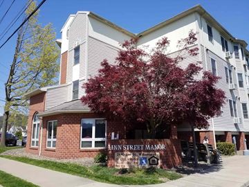Williamsport apartment for rent - an apartment building with a tree in front of it