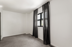 Washington apartment for rent - an empty room with white walls and a window with black curtains