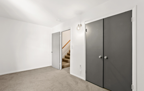 Washington apartment for rent - a bedroom with two doors and a staircase in a house