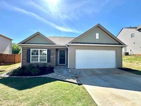 Piedmont house for rent - the front of a house with a driveway and a garage door