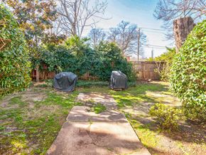 Greenville house for rent - a backyard with two tarp tents on the grass