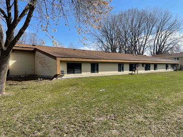 Eden Valley apartment for rent - the front of a white house with a yard and a tree
