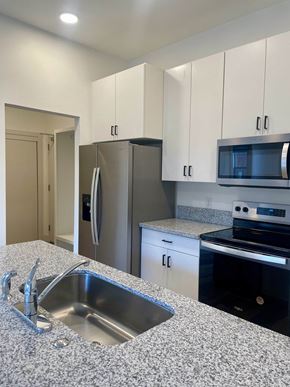 Jackson apartment for rent - a kitchen with granite counter tops and stainless steel appliances