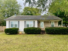 Pewee Valley house for rent - A house with a grey roof and a small porch.