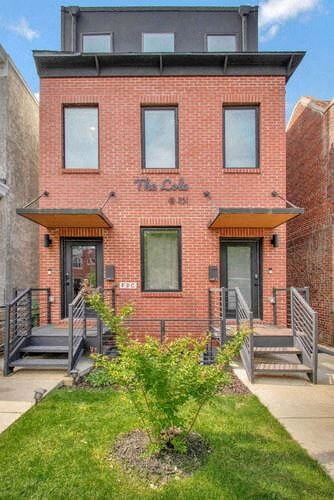 Washington house for rent - the front of a brick building with a yard and stairs